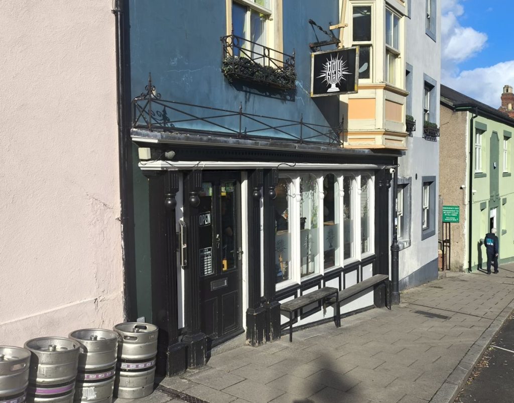 Exterior of the Holy GrAle Micropub on Crossgate, Durham with beer kegs in the foreground