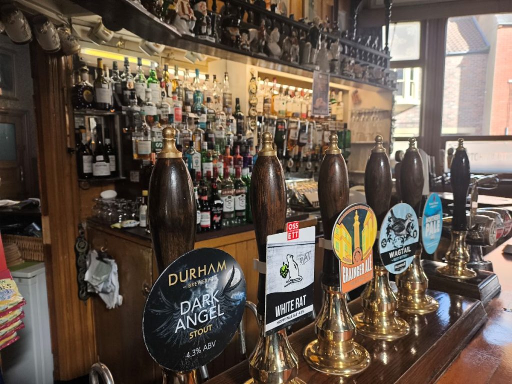 The bar at the Victoria Inn on Hallgarth Street, Durham showing bar back, and beer pumps