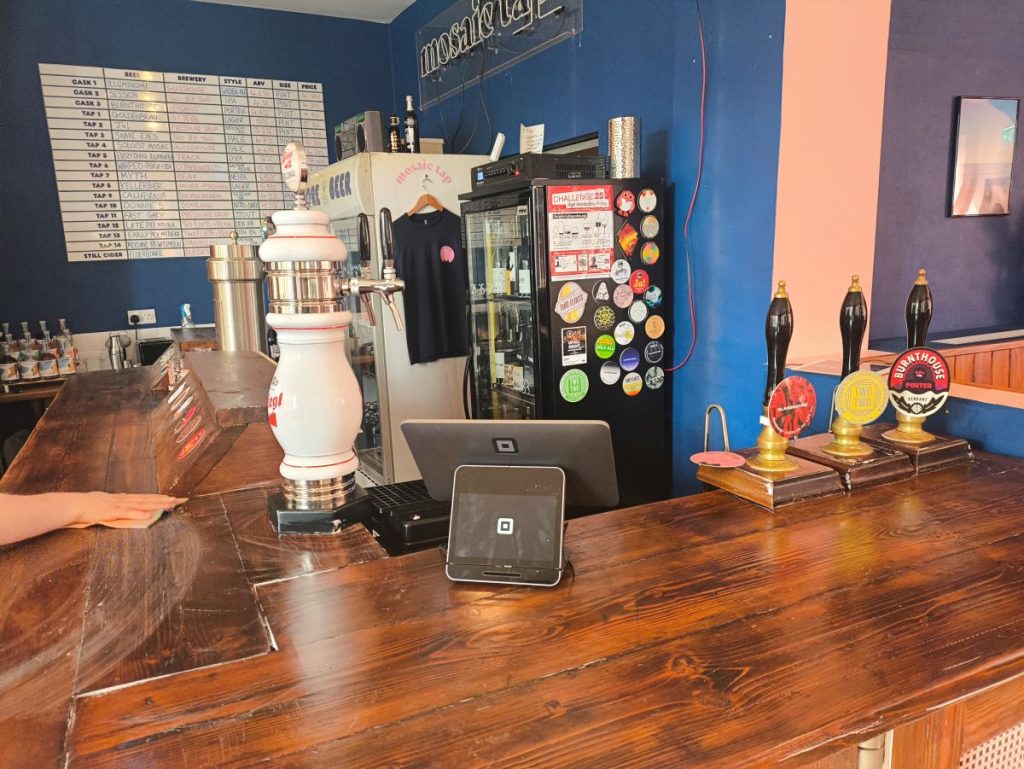 Bar at the Mosaic Tap Newcastle showing beer list and real ale pumps