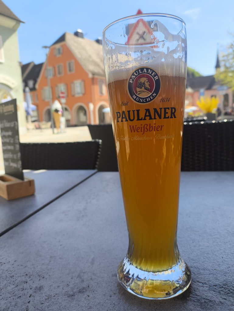 A Paulaner weissbier on a table at Cafe Bechtel in the Marktplatz in Breisach Germany