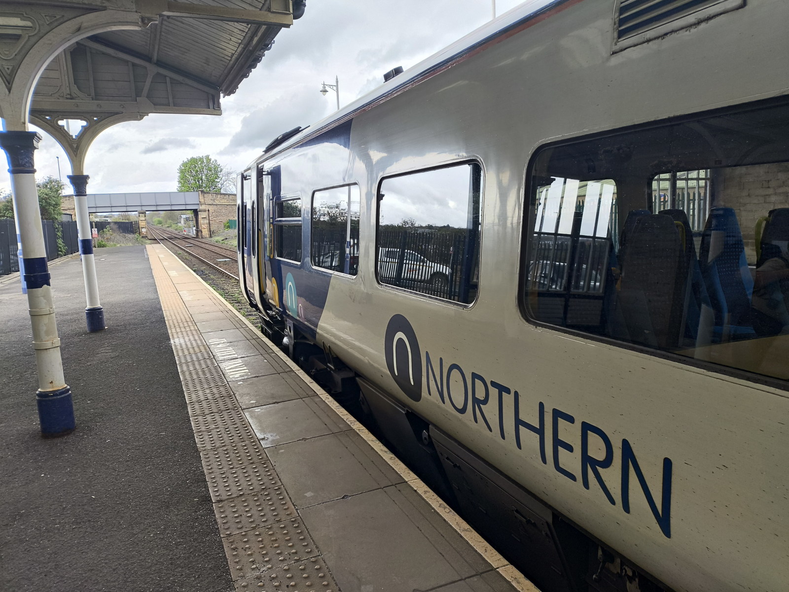 A Northern Train standing at platform 1 of Hexham railway station