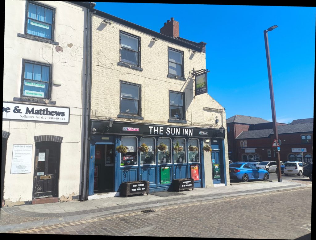 The exterior of The Sun Inn in Stockton sets against a blue sky