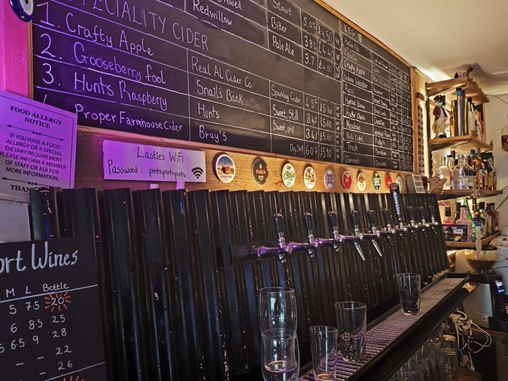 Back bar of the Last Resort micropub, Heaton Road, Newcastle showing keg lines and a chalkboard of beers.