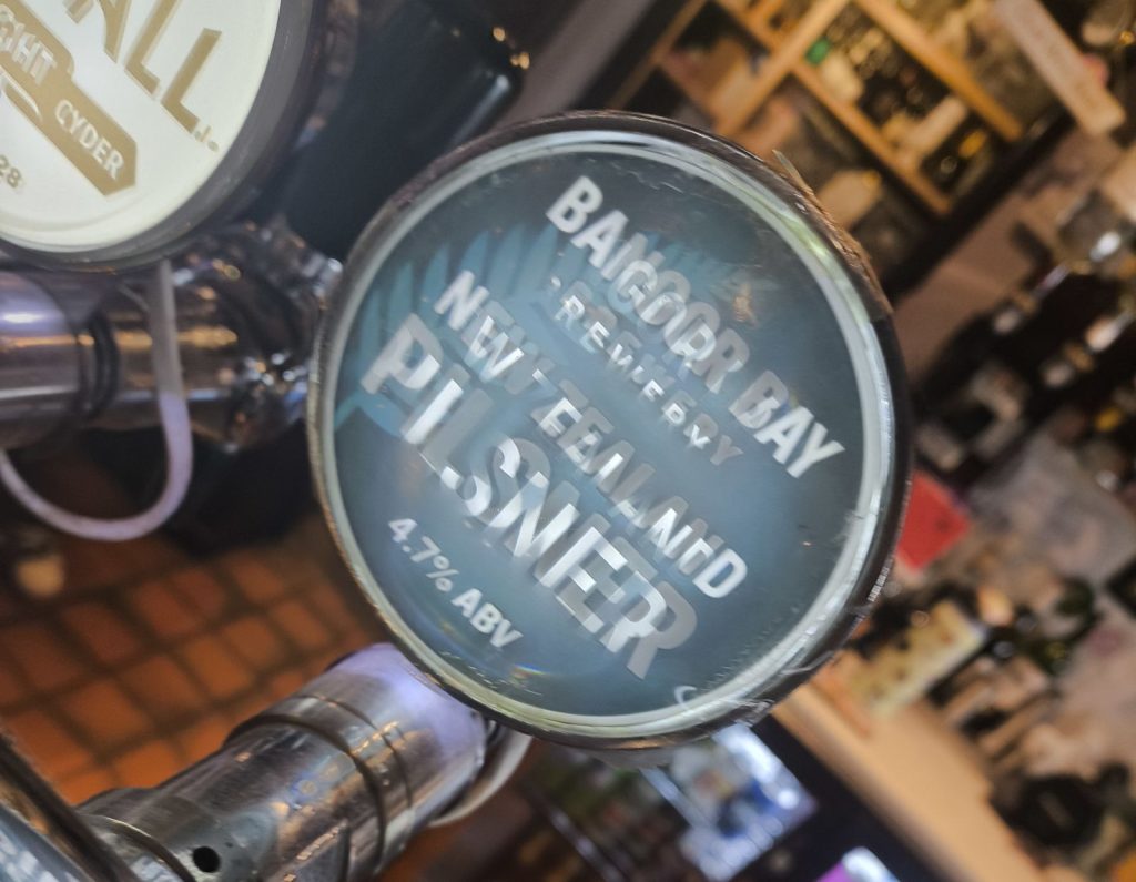 Beer pump for New Zealand Pilsner by Bangor Bay Brewery on the bar at the Kings Quay pub in Bangor.