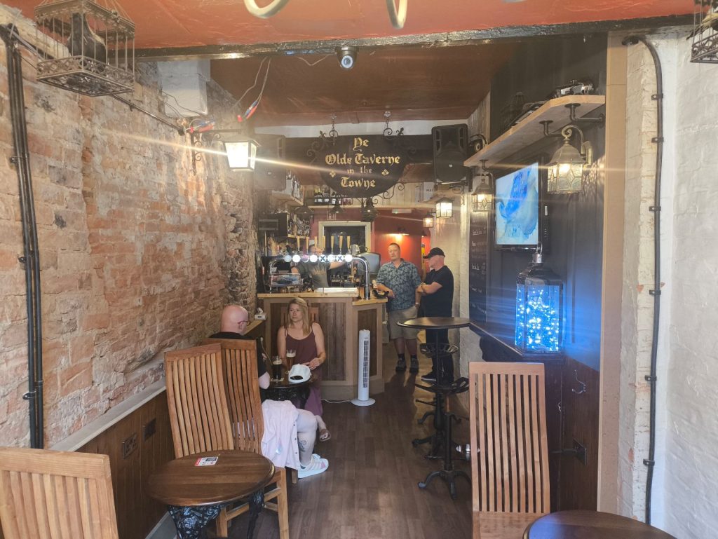 The Other Side pub at Darlington showing customers enjoying a drink.